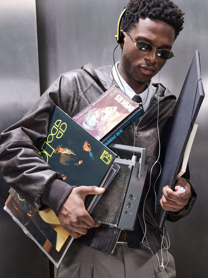 Team member carrying records and a boombox