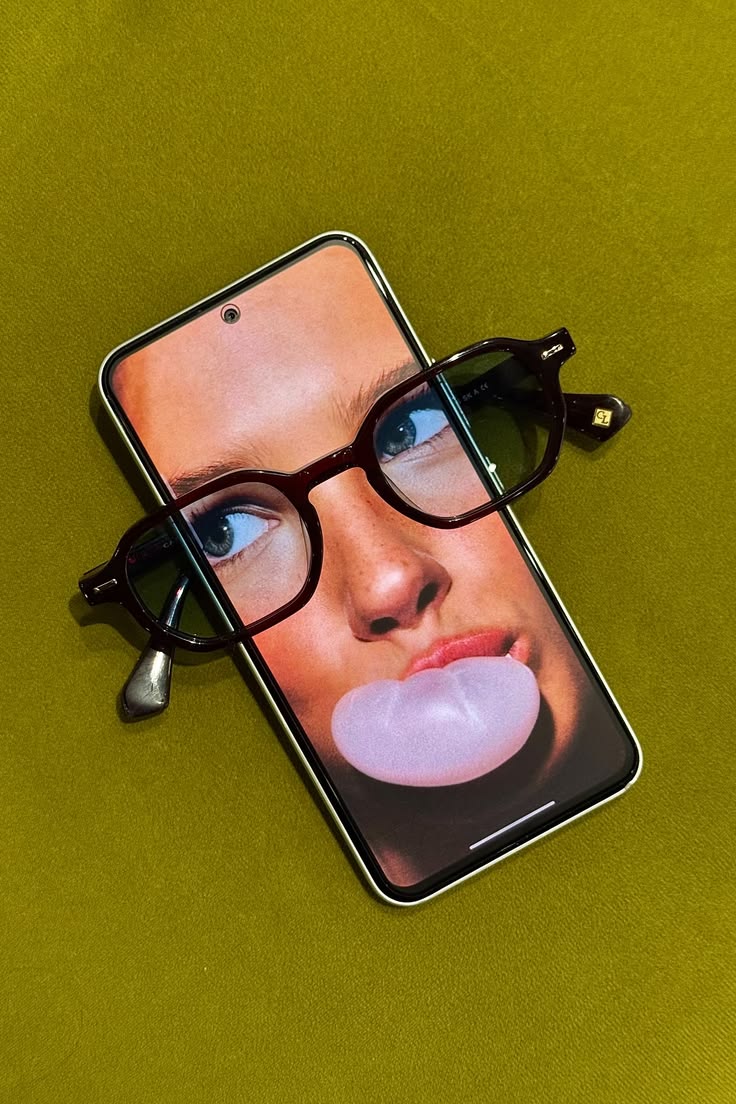 Lupa Optics phone and frames on olive background